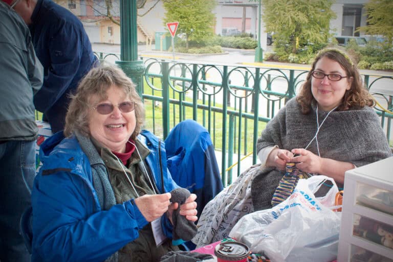 Volunteer knitting at Repair Cafe event in Ridge Meadows Recycling Society.