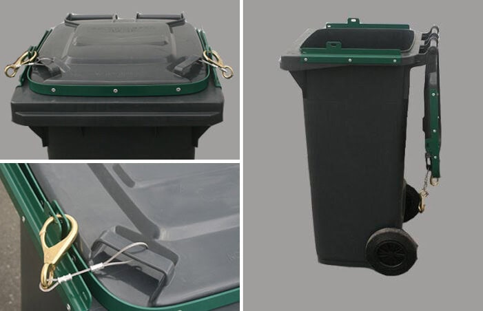 Recycling bin with secure lid and wheels for waste disposal.